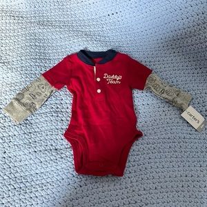 Red Onesie with sports ball decorated sleeves